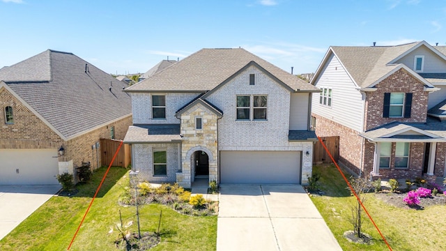 6223 Milbridge Creek Ln, Katy, TX 77493 - view of front facade featuring driveway, brick siding, and an attached garage