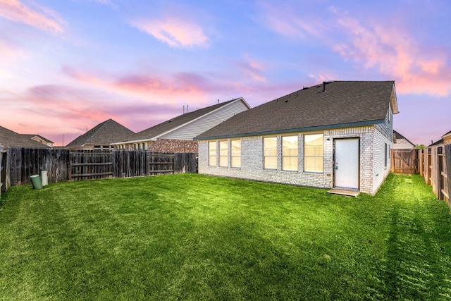 6223 Milbridge Creek Ln, Katy, TX 77493 - rear view of house featuring roof with shingles and brick siding