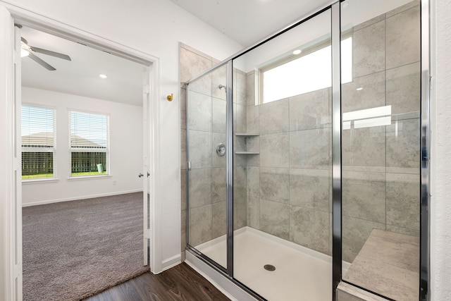 6223 Milbridge Creek Ln, Katy, TX 77493 - bathroom featuring wood finished floors, a shower stall, a ceiling fan, baseboards, and recessed lighting