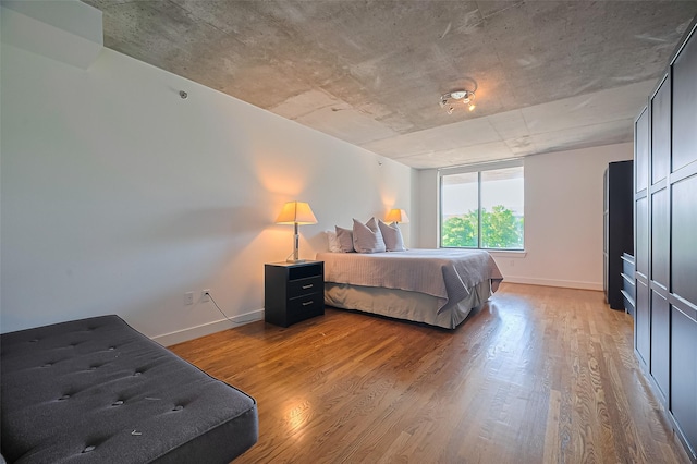 5005 Hidalgo St Unit 410, Houston, TX 77056 - bedroom featuring wood finished floors and baseboards