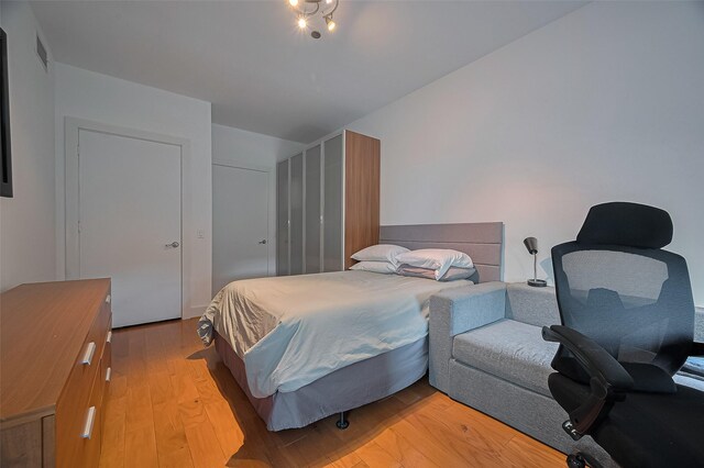 5005 Hidalgo St Unit 410, Houston, TX 77056 - bedroom featuring light wood-style floors