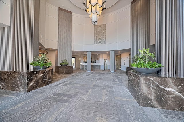 5005 Hidalgo St Unit 410, Houston, TX 77056 - reception area with a high ceiling, a chandelier, and ornate columns