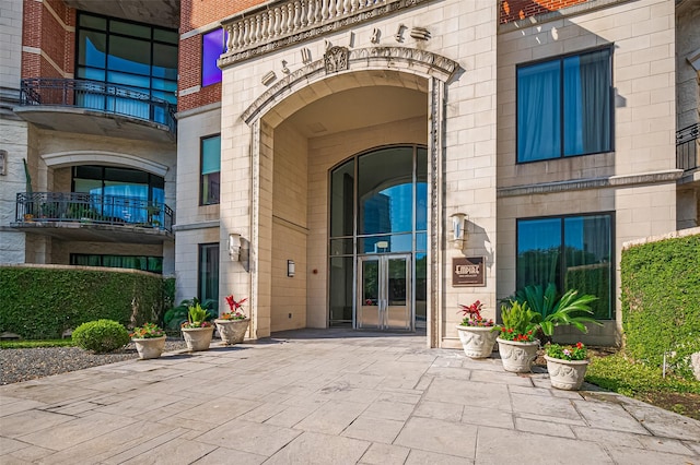 5005 Hidalgo St Unit 410, Houston, TX 77056 - property entrance featuring french doors, brick siding, and stone siding