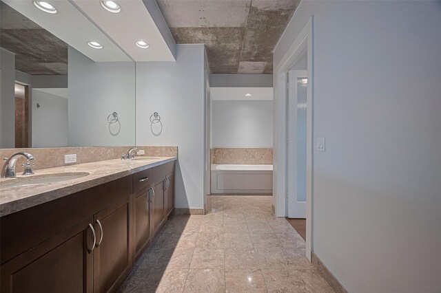 5005 Hidalgo St Unit 410, Houston, TX 77056 - full bath with baseboards, a bath, and double vanity