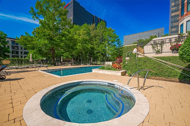 5005 Hidalgo St Unit 410, Houston, TX 77056 - community pool featuring a hot tub and a patio