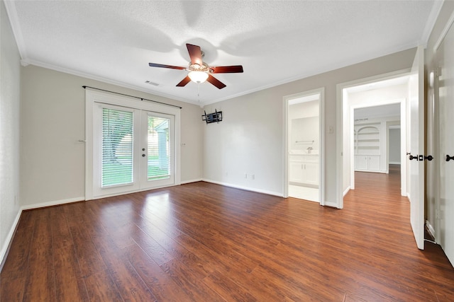 spare room with french doors, dark wood-style floors, ceiling fan, ornamental molding, and baseboards