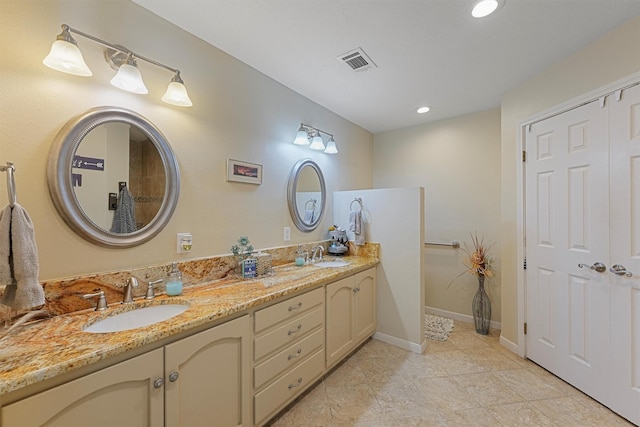 4701 County Road 747a, Brazoria, TX 77422 - full bath with double vanity, recessed lighting, tile patterned floors, and baseboards