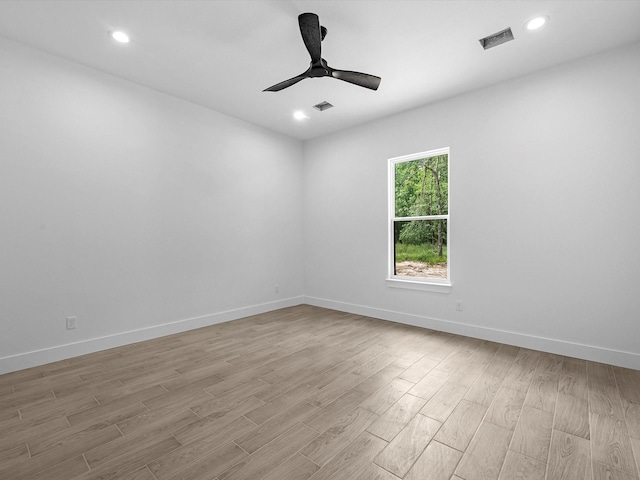 538 Rd 660, Dayton, TX 77535 - empty room featuring light wood-style floors, ceiling fan, baseboards, and recessed lighting