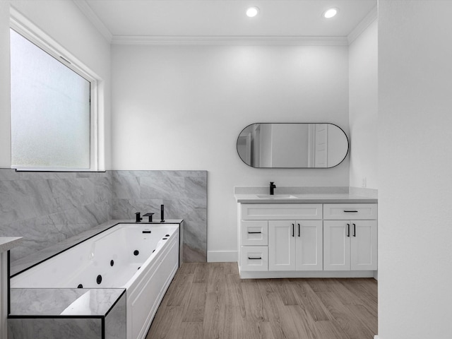 538 Rd 660, Dayton, TX 77535 - full bath with crown molding, vanity, wood finished floors, a tub with jets, and baseboards