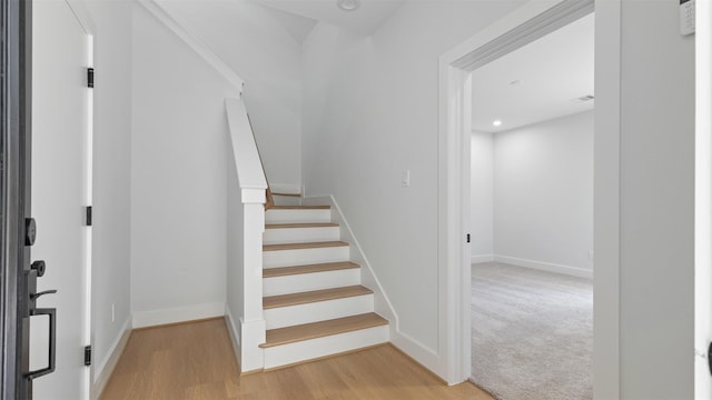 7229 Tierwester St, Houston, TX 77021 - stairs featuring baseboards, wood finished floors, and recessed lighting