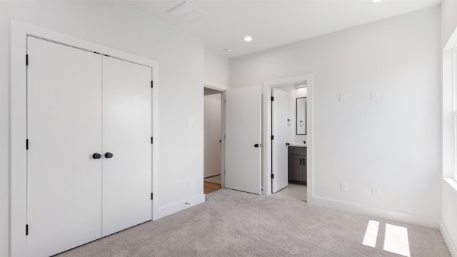 7229 Tierwester St, Houston, TX 77021 - unfurnished bedroom with light colored carpet, baseboards, recessed lighting, a closet, and ensuite bath