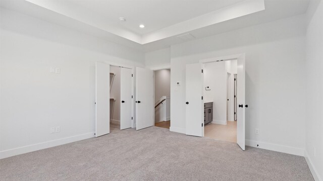 7229 Tierwester St, Houston, TX 77021 - unfurnished bedroom featuring light carpet, recessed lighting, baseboards, a walk in closet, and ensuite bathroom