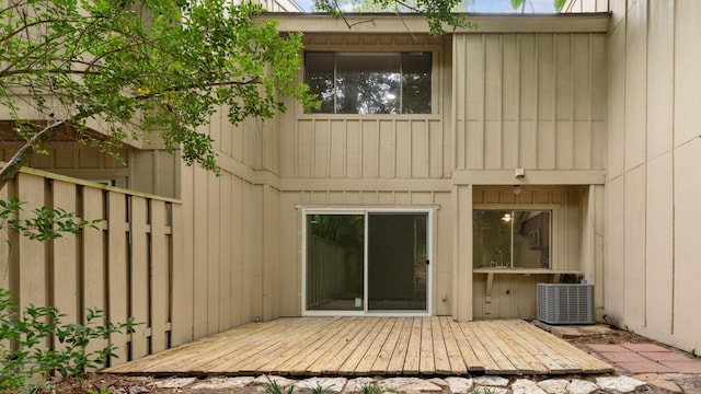 2139 E Settlers Way, The Woodlands, TX 77380 - back of property featuring central AC and a deck