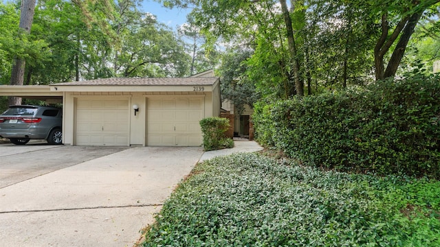2139 E Settlers Way, The Woodlands, TX 77380 - garage featuring driveway and a detached garage