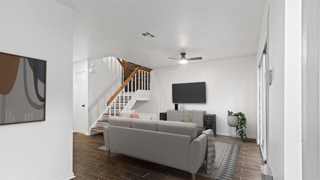 2139 E Settlers Way, The Woodlands, TX 77380 - living room with dark wood finished floors, baseboards, stairway, and a ceiling fan