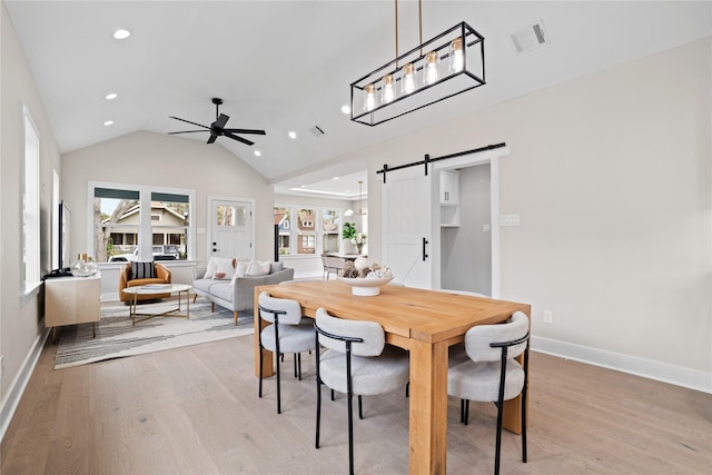 1118 W Cottage St, Houston, TX 77009 - dining room with a barn door, recessed lighting, light wood-style floors, plenty of natural light, and a ceiling fan