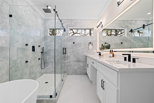 1118 W Cottage St, Houston, TX 77009 - full bath featuring a stall shower, tile walls, ornamental molding, double vanity, and a freestanding tub