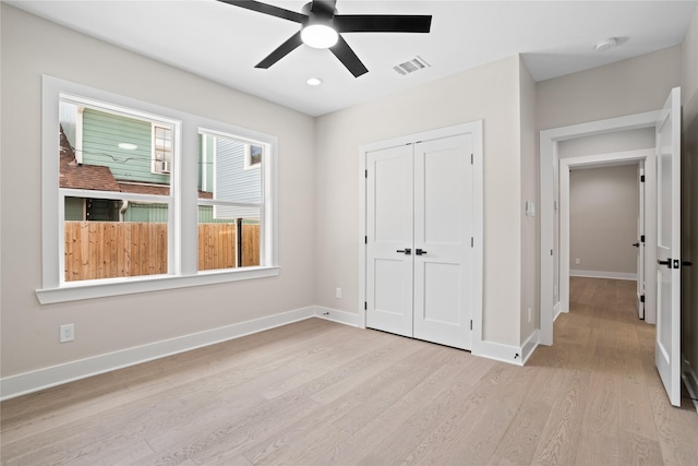 1118 W Cottage St, Houston, TX 77009 - unfurnished bedroom featuring light wood-type flooring, baseboards, a closet, a ceiling fan, and recessed lighting