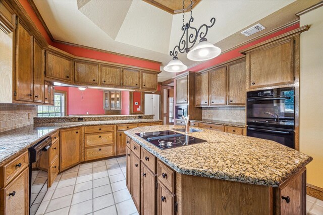 15706 Pinewood Cove Dr, Houston, TX 77062 - kitchen featuring black appliances, light tile patterned floors, backsplash, and an island with sink