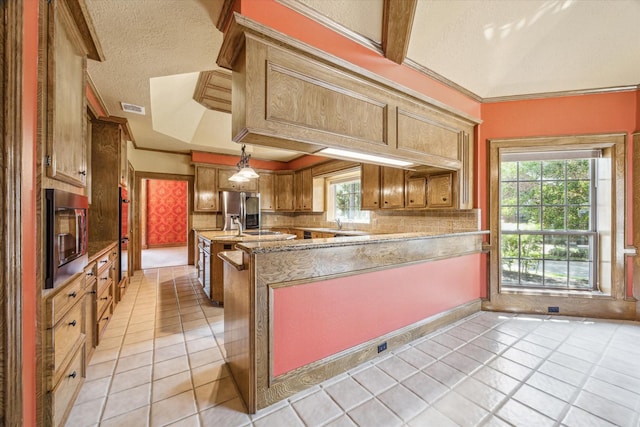 15706 Pinewood Cove Dr, Houston, TX 77062 - kitchen with appliances with stainless steel finishes, light tile patterned flooring, ornamental molding, healthy amount of natural light, and light stone countertops