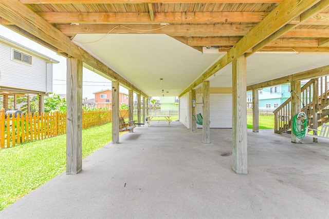 4030 Fort Bend Dr, Galveston, TX 77554 - view of patio featuring stairs and an attached garage