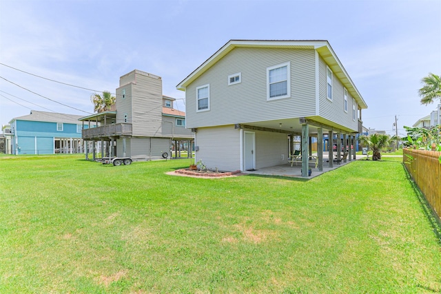 4030 Fort Bend Dr, Galveston, TX 77554 - rear view of property with a patio and a carport