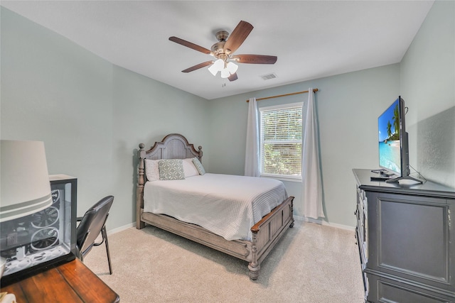 24628 Hosford Meadows Dr, Porter, TX 77365 - bedroom featuring light colored carpet, baseboards, and a ceiling fan