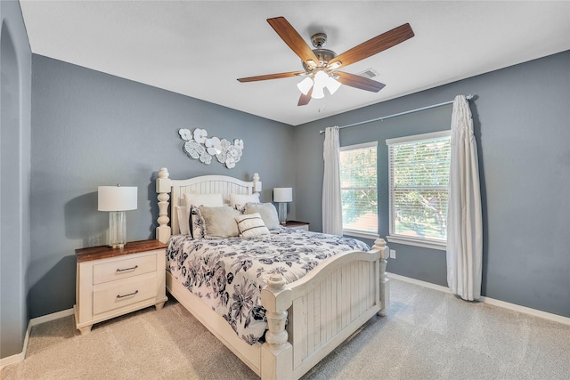 24628 Hosford Meadows Dr, Porter, TX 77365 - bedroom with baseboards, a ceiling fan, and light carpet