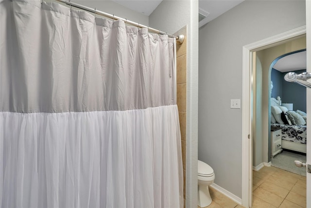 24628 Hosford Meadows Dr, Porter, TX 77365 - full bath featuring tile patterned flooring, toilet, ensuite bathroom, and curtained shower