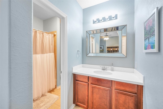 24628 Hosford Meadows Dr, Porter, TX 77365 - full bathroom featuring tile patterned flooring, vanity, a textured wall, a shower with shower curtain, and a ceiling fan