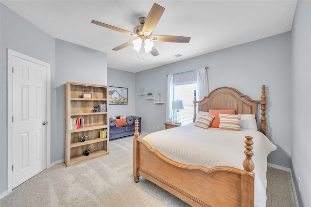 24628 Hosford Meadows Dr, Porter, TX 77365 - bedroom featuring light colored carpet, baseboards, and a ceiling fan