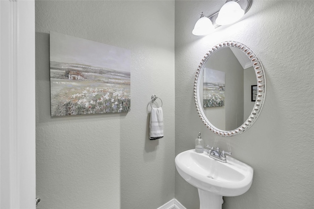 24628 Hosford Meadows Dr, Porter, TX 77365 - bathroom featuring a sink and a textured wall