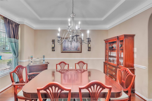 24628 Hosford Meadows Dr, Porter, TX 77365 - dining space featuring a tray ceiling, a chandelier, wood finished floors, baseboards, and ornamental molding