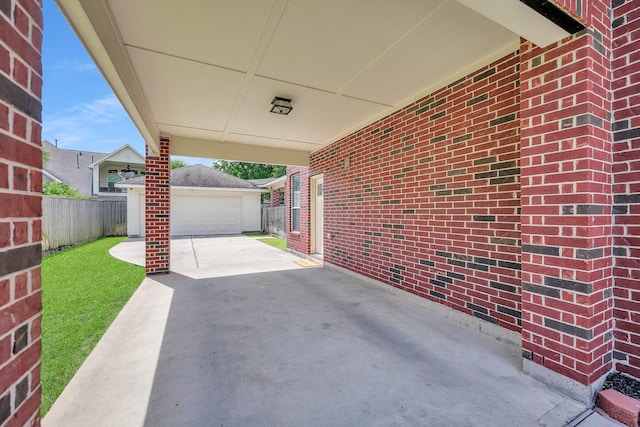 24628 Hosford Meadows Dr, Porter, TX 77365 - view of patio with an outbuilding and fence