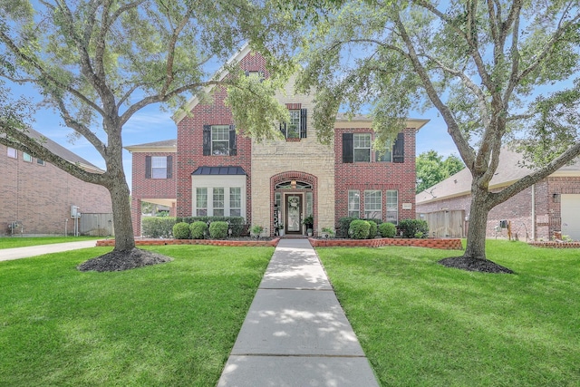 24628 Hosford Meadows Dr, Porter, TX 77365 - traditional-style home with a front yard and brick siding