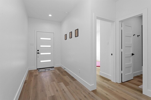 4021 King St, Houston, TX 77026 - entryway featuring light wood-style floors, baseboards, and recessed lighting