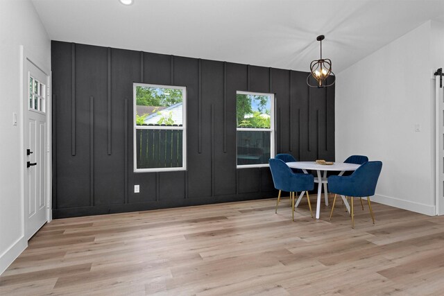 4021 King St, Houston, TX 77026 - dining space featuring light wood finished floors, baseboards, and a decorative wall