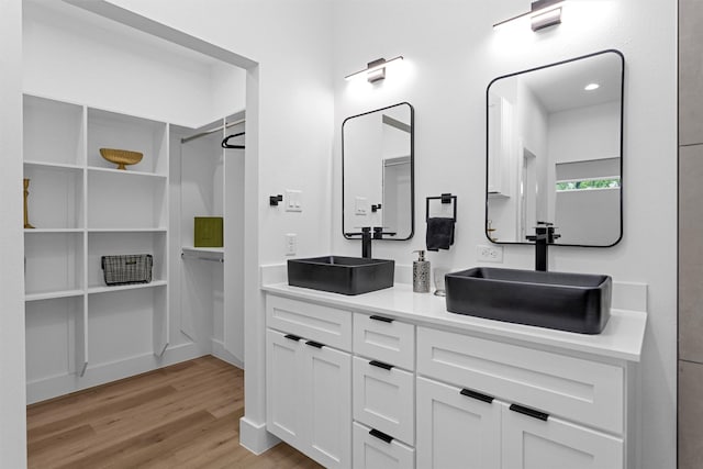 4021 King St, Houston, TX 77026 - full bathroom with wood finished floors and double vanity