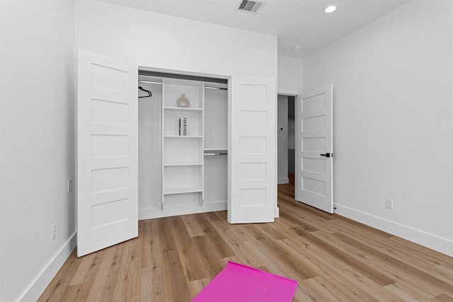 4021 King St, Houston, TX 77026 - unfurnished bedroom featuring wood finished floors, baseboards, a closet, and recessed lighting