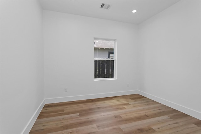 4021 King St, Houston, TX 77026 - spare room with baseboards, light wood-type flooring, and recessed lighting