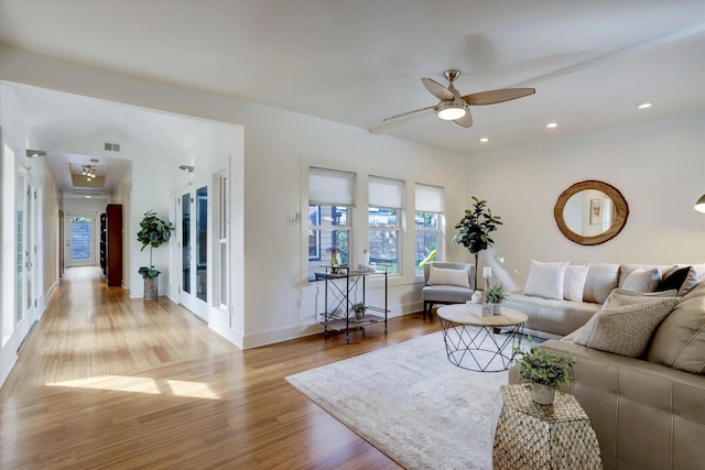 924 E 27th St, Houston, TX 77009 - living room with a ceiling fan, light wood-style flooring, baseboards, and recessed lighting