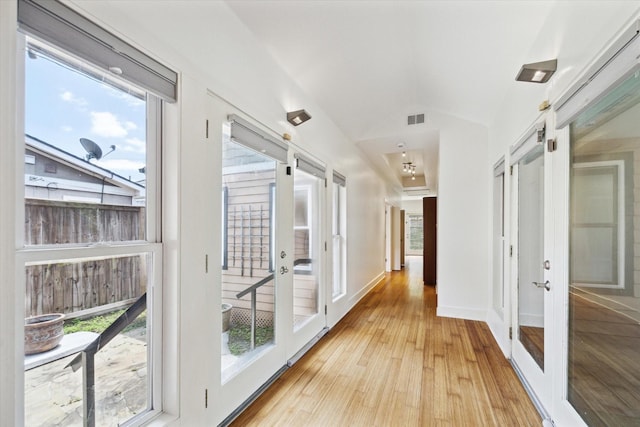 924 E 27th St, Houston, TX 77009 - corridor with french doors, light wood-style flooring, and lofted ceiling