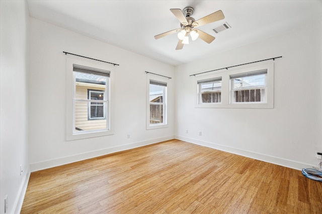 924 E 27th St, Houston, TX 77009 - spare room featuring wood finished floors, baseboards, and plenty of natural light