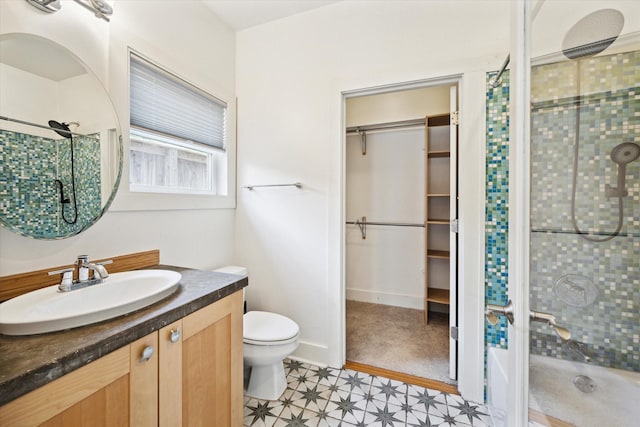 924 E 27th St, Houston, TX 77009 - bathroom featuring a shower stall, a walk in closet, and toilet