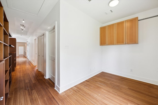 924 E 27th St, Houston, TX 77009 - hallway featuring wood finished floors and baseboards