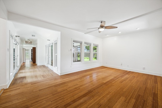 924 E 27th St, Houston, TX 77009 - unfurnished room featuring ceiling fan, light wood finished floors, and baseboards