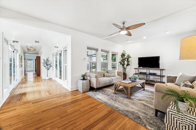 924 E 27th St, Houston, TX 77009 - living area featuring light wood-style floors, a ceiling fan, recessed lighting, and baseboards