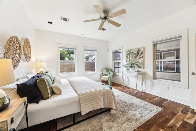 924 E 27th St, Houston, TX 77009 - bedroom with wood finished floors, a ceiling fan, and baseboards
