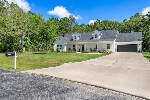 8729 Nathan Dr, Waller, TX 77484 - cape cod home with a garage, a front yard, driveway, roof with shingles, and covered porch