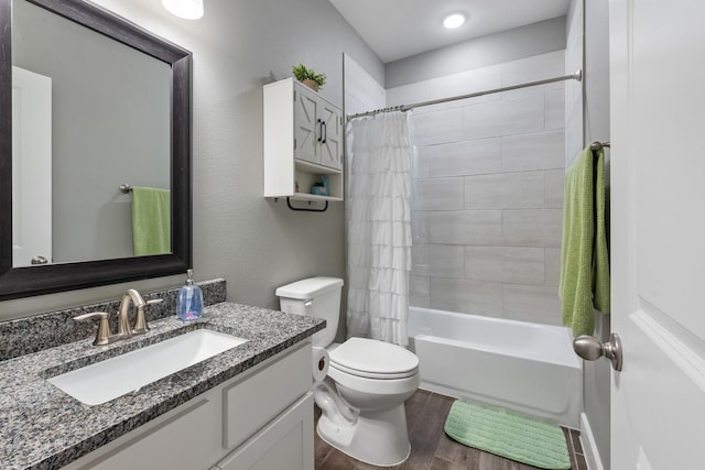 8729 Nathan Dr, Waller, TX 77484 - full bathroom featuring wood finished floors, toilet, vanity, and shower / bathtub combination with curtain